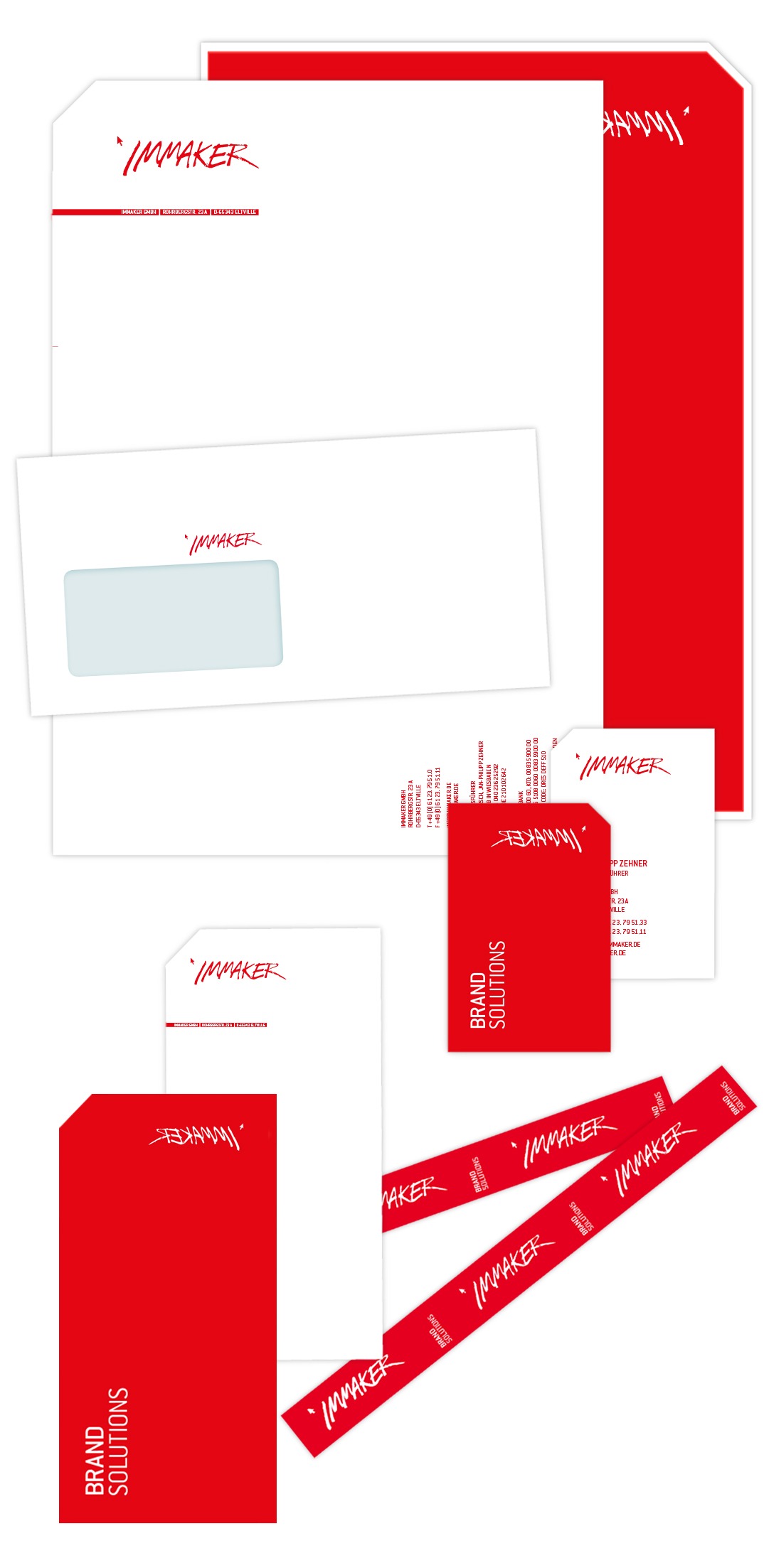 Ein Satz Markenbriefpapier in Rot und Weiß, auf dem der Name IMMAKER deutlich sichtbar auf Briefköpfen, Umschlägen, Ordnern, Visitenkarten und Aufklebern zu sehen ist – perfekt, um Ihre Immaker-Identität zu präsentieren.